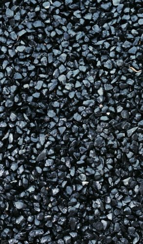 High-resolution close-up of dark gravel texture, ideal for backgrounds and design projects.
