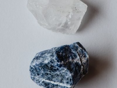 Home A detailed close-up of raw quartz and sodalite stones showcasing natural textures.