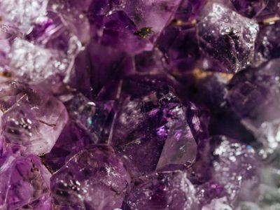 Home Detailed view of purple amethyst crystals showcasing their natural beauty.