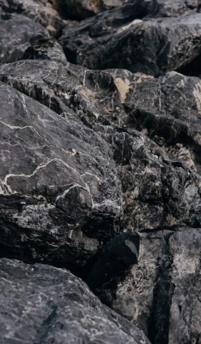 High-resolution close-up of textured gray rocks, showcasing natural patterns and rugged beauty.